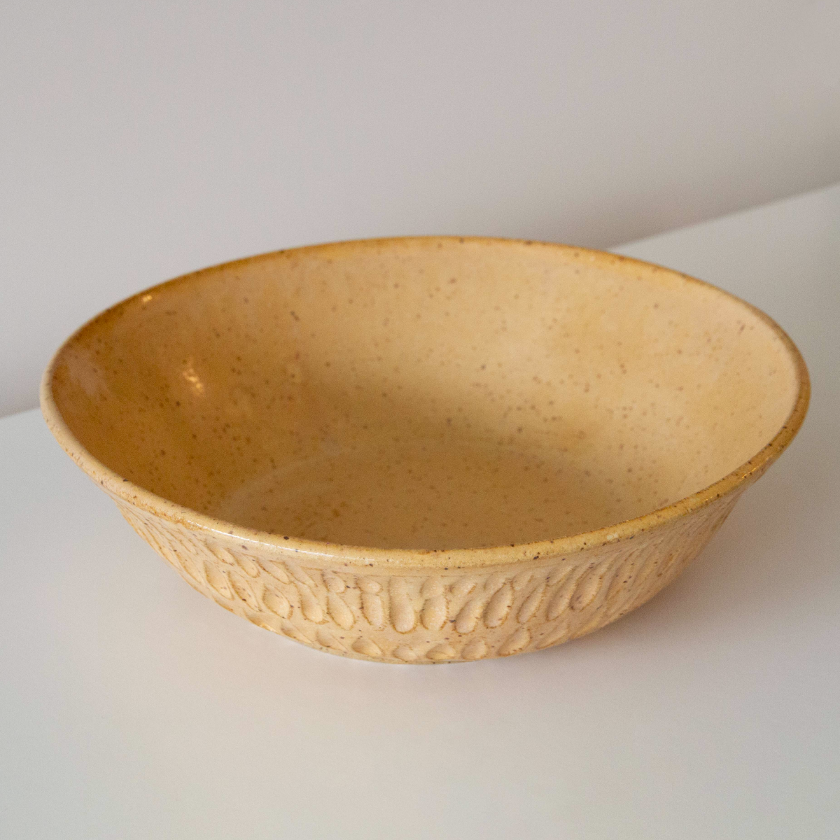 Carved golden sand bowl