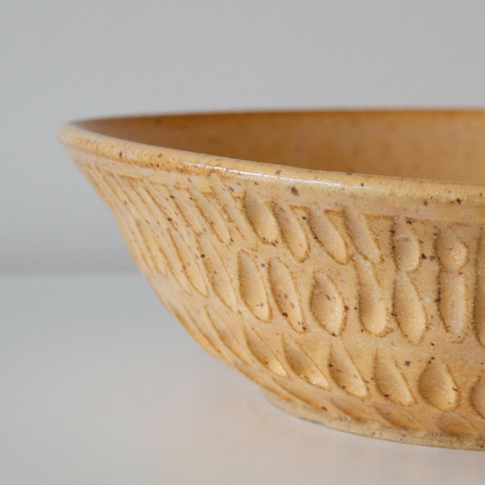 Carved golden sand bowl