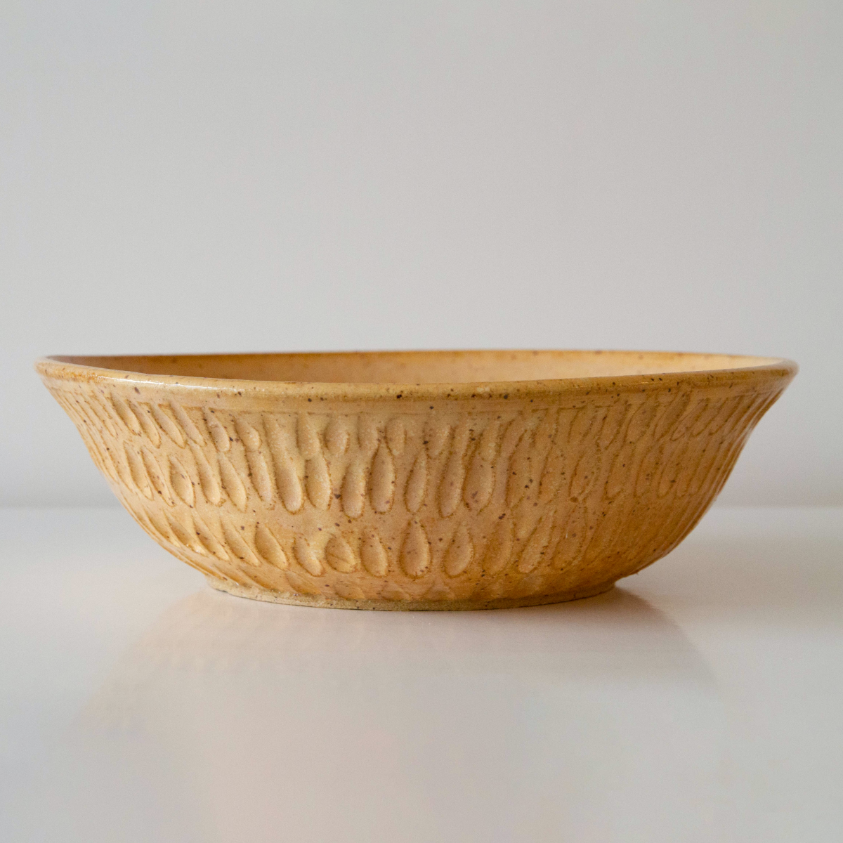 Carved golden sand bowl